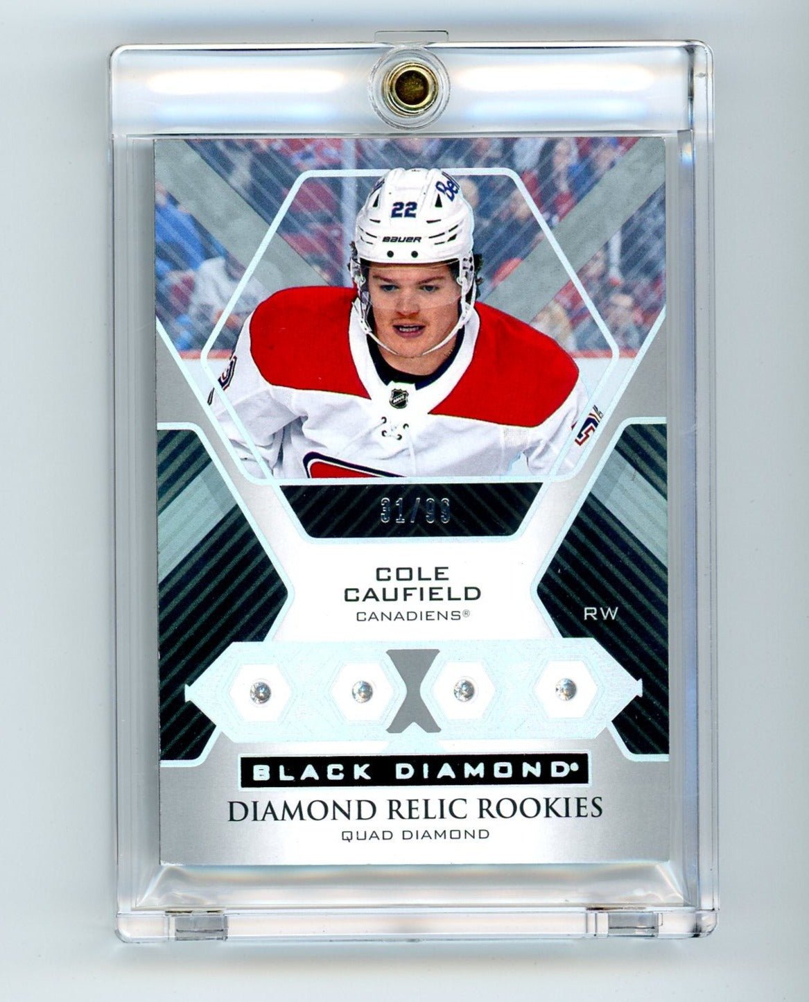 img855_0adc1743-24a1-4061-9582-1cc92e3b3425.jpg Cole Caufield 2022 Upper Deck Black Diamond Quad Diamond Relic Rookies #'d 31/99 - Image 1